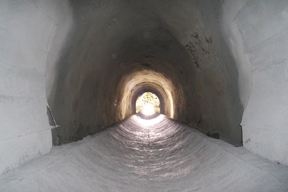 a tunnel with a light at the end of it