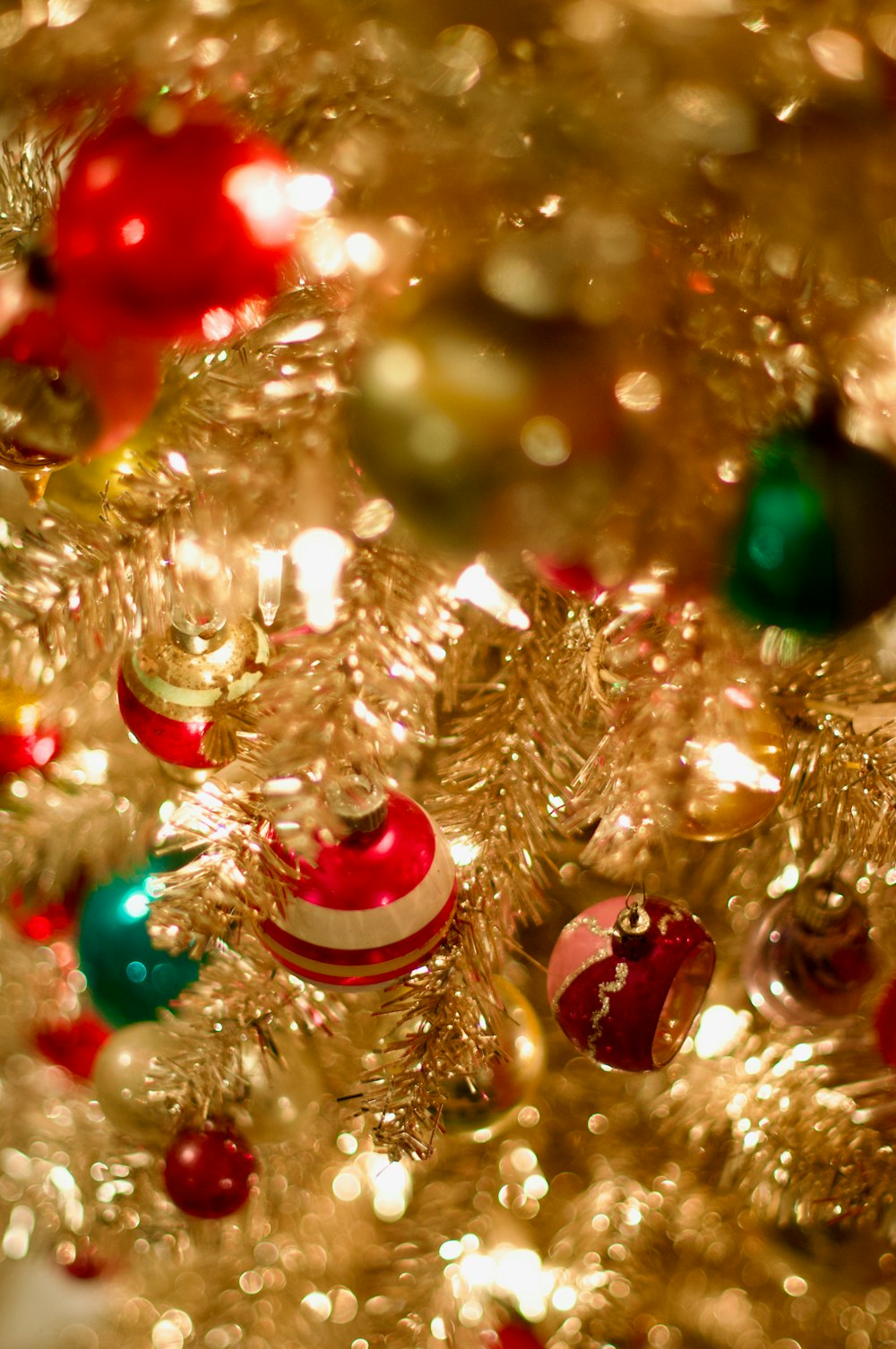 a close up of a christmas tree with ornaments