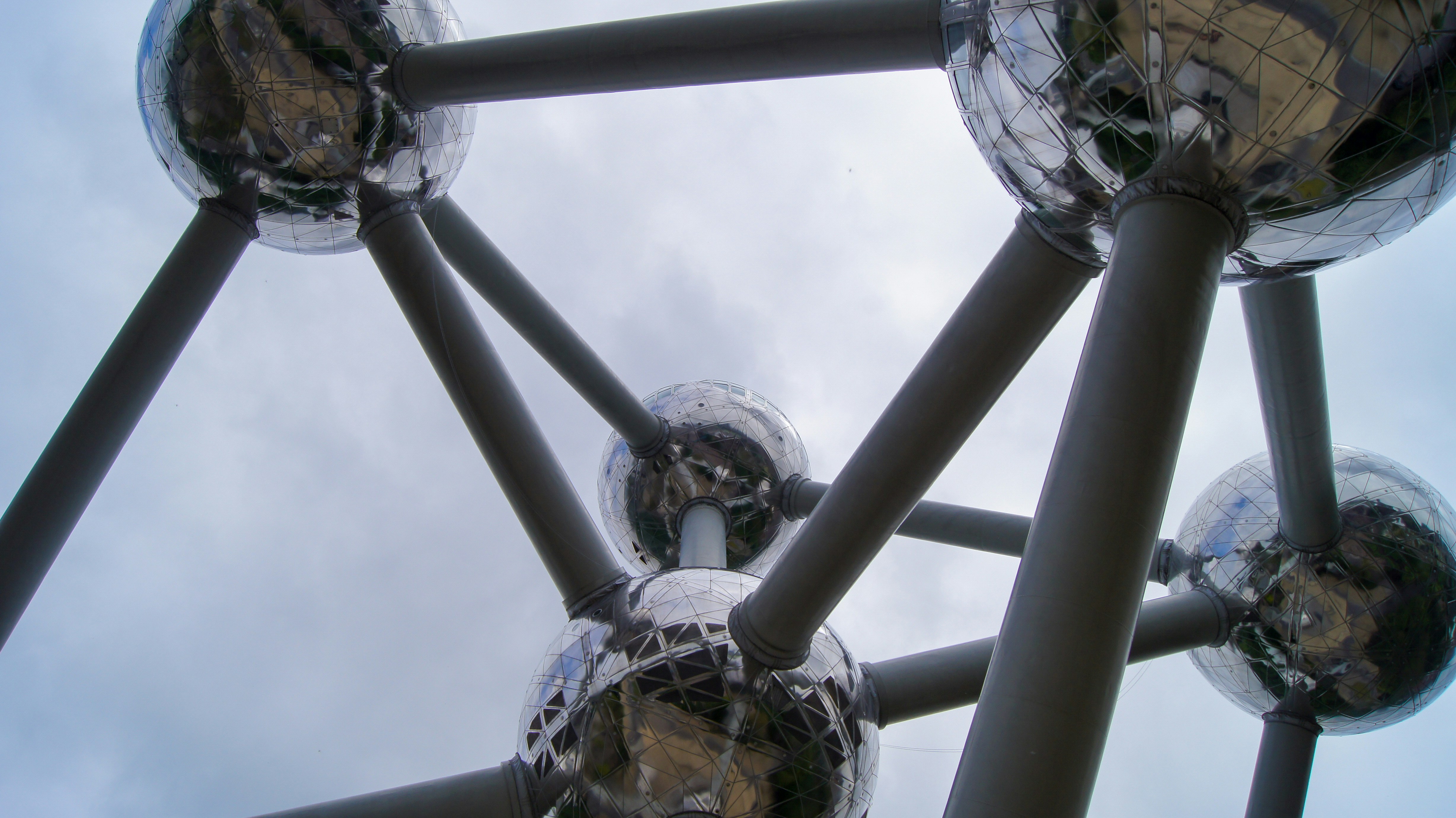 a large metal structure with mirrored balls on it