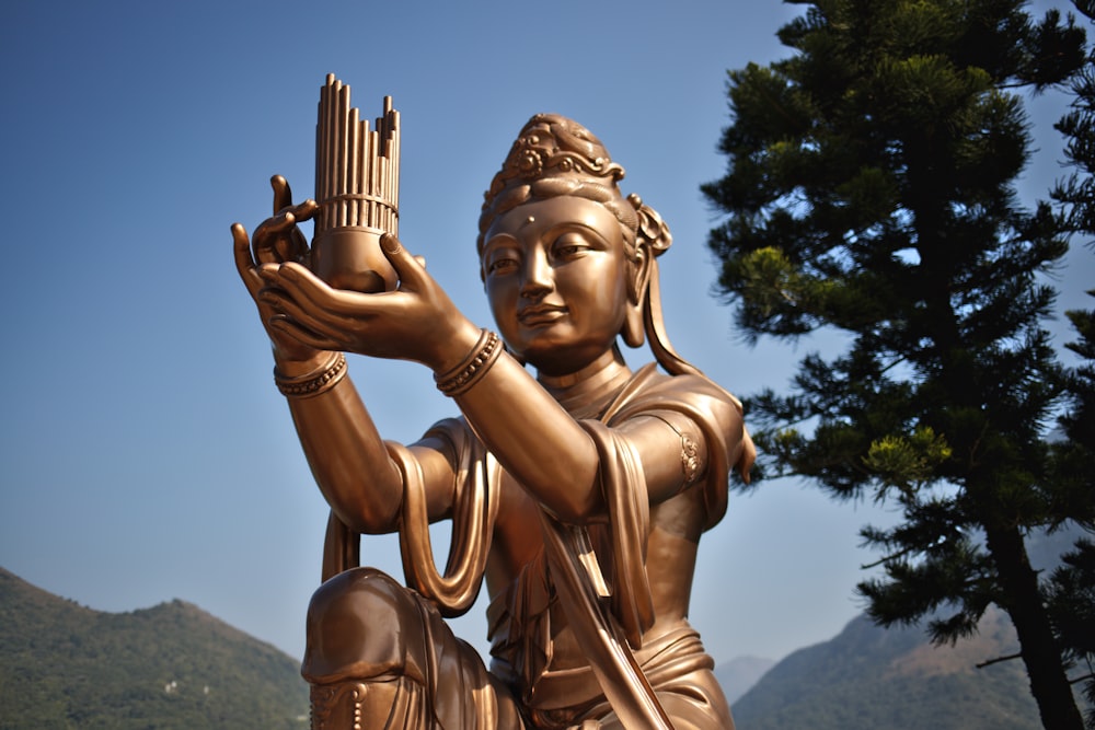 a statue of a woman holding a basket