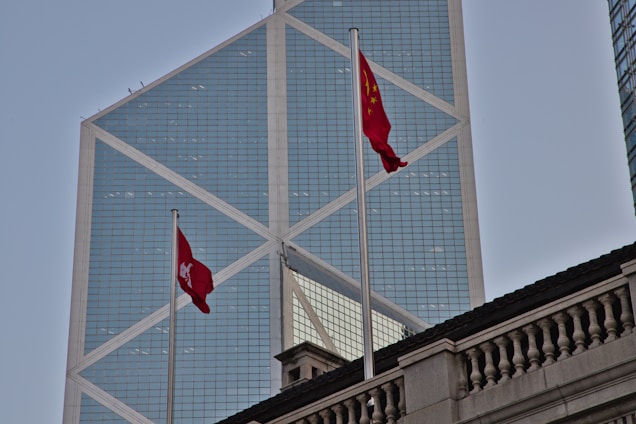 Modern embassy building with flags of two countries outside