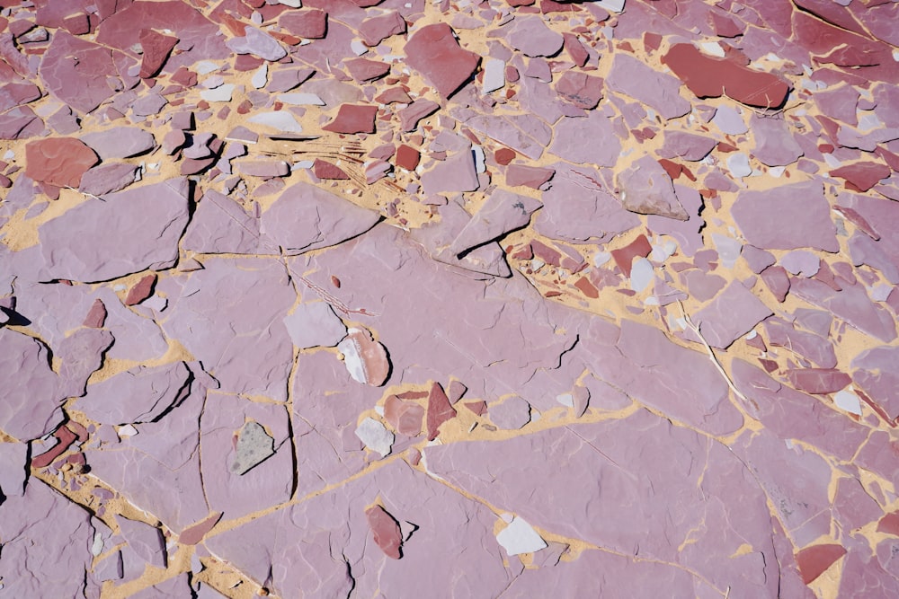 a close up of a rock surface with cracks