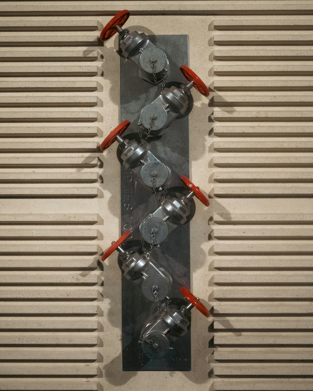 a group of valves mounted to a wall