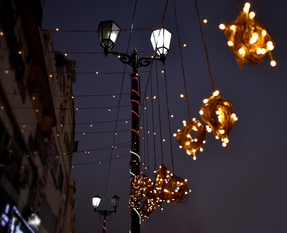 a pole with some lights hanging off of it