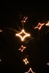 An intricate Vedic birth chart glowing softly against a dark starry background.