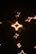 Close-up of golden stars shining brightly on a dark background, symbolizing excellent reviews.