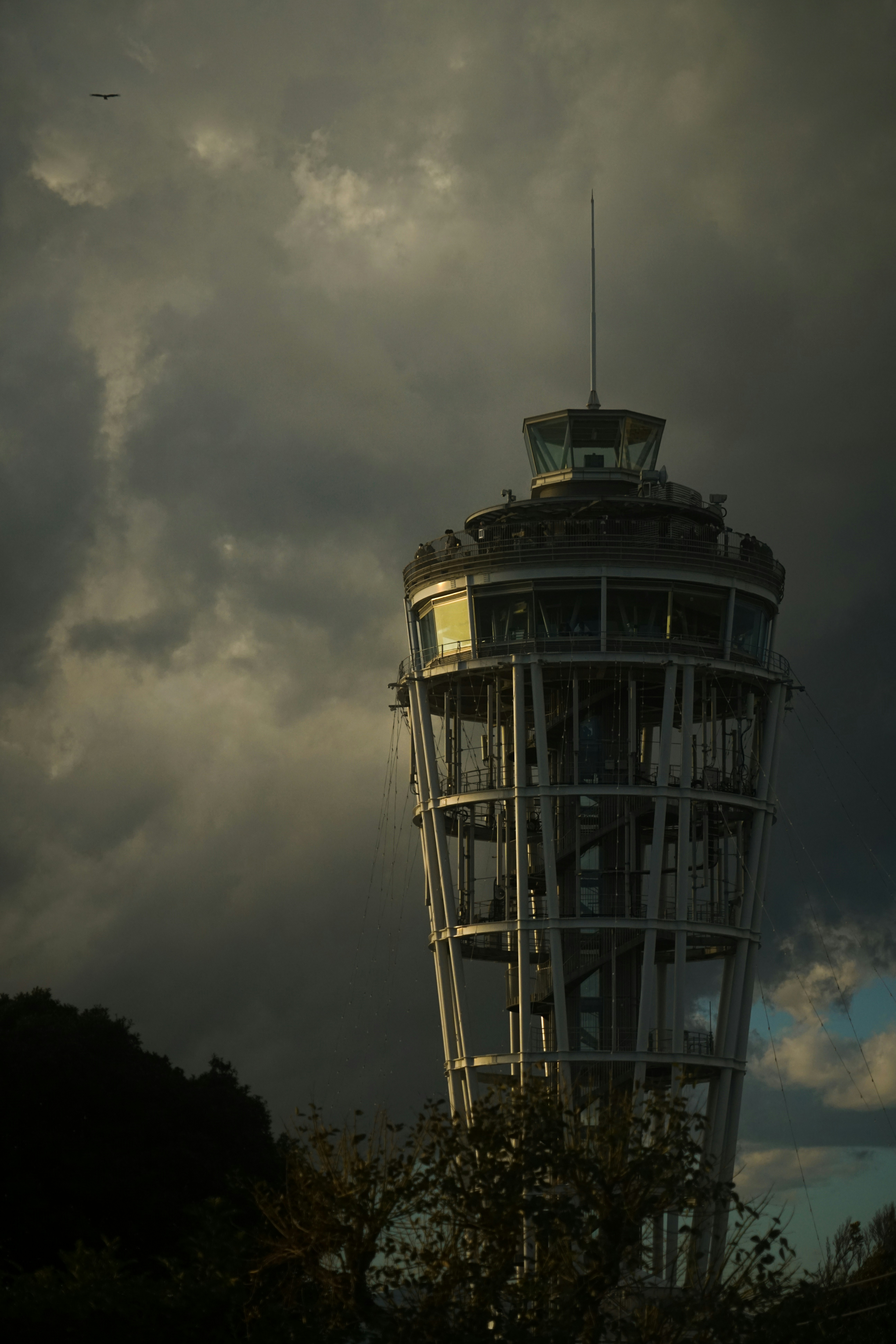 a tall tower with a clock on the top of it
