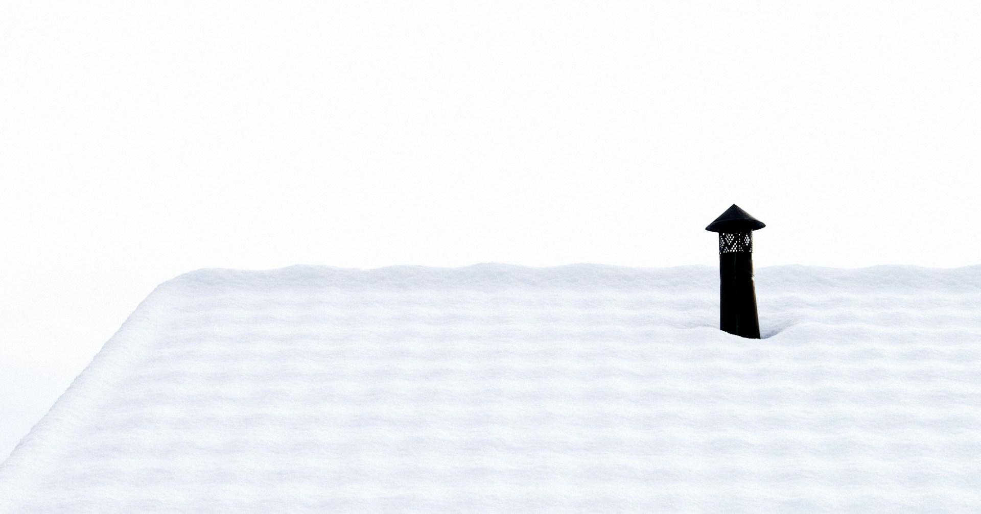 a black arrow sticking out of the snow