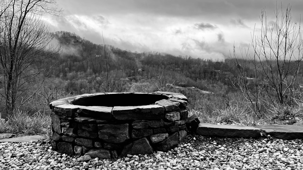 a black and white photo of a fire pit