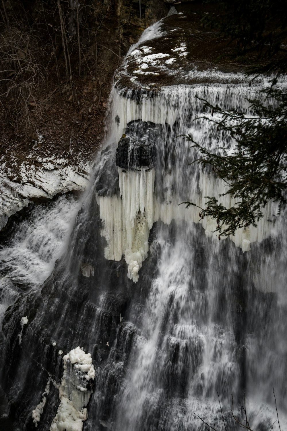 a waterfall with ice on the side of it