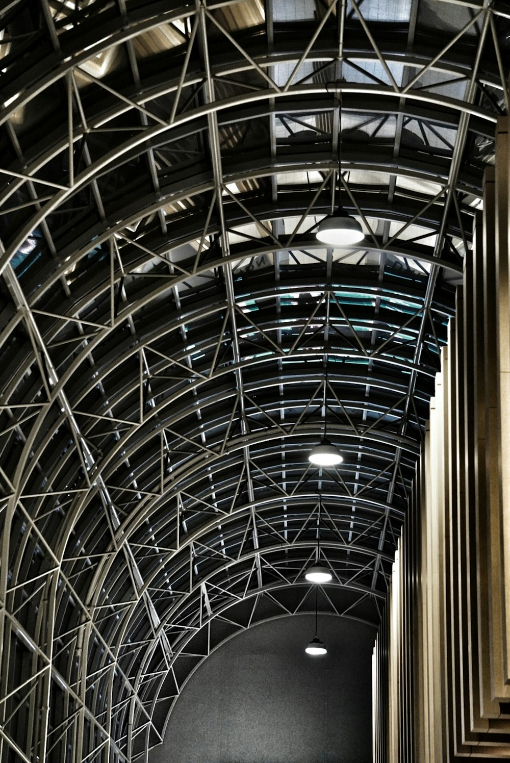 a large metal structure with a clock on it