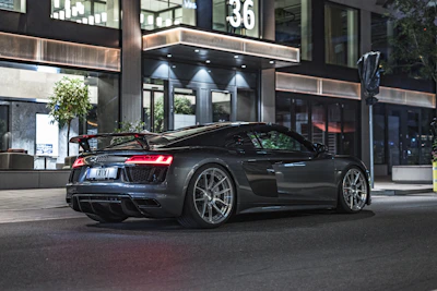 Sporty car with shiny tires parked on city street