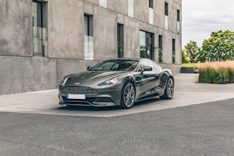 A sleek car parked outside a stylish urban home.
