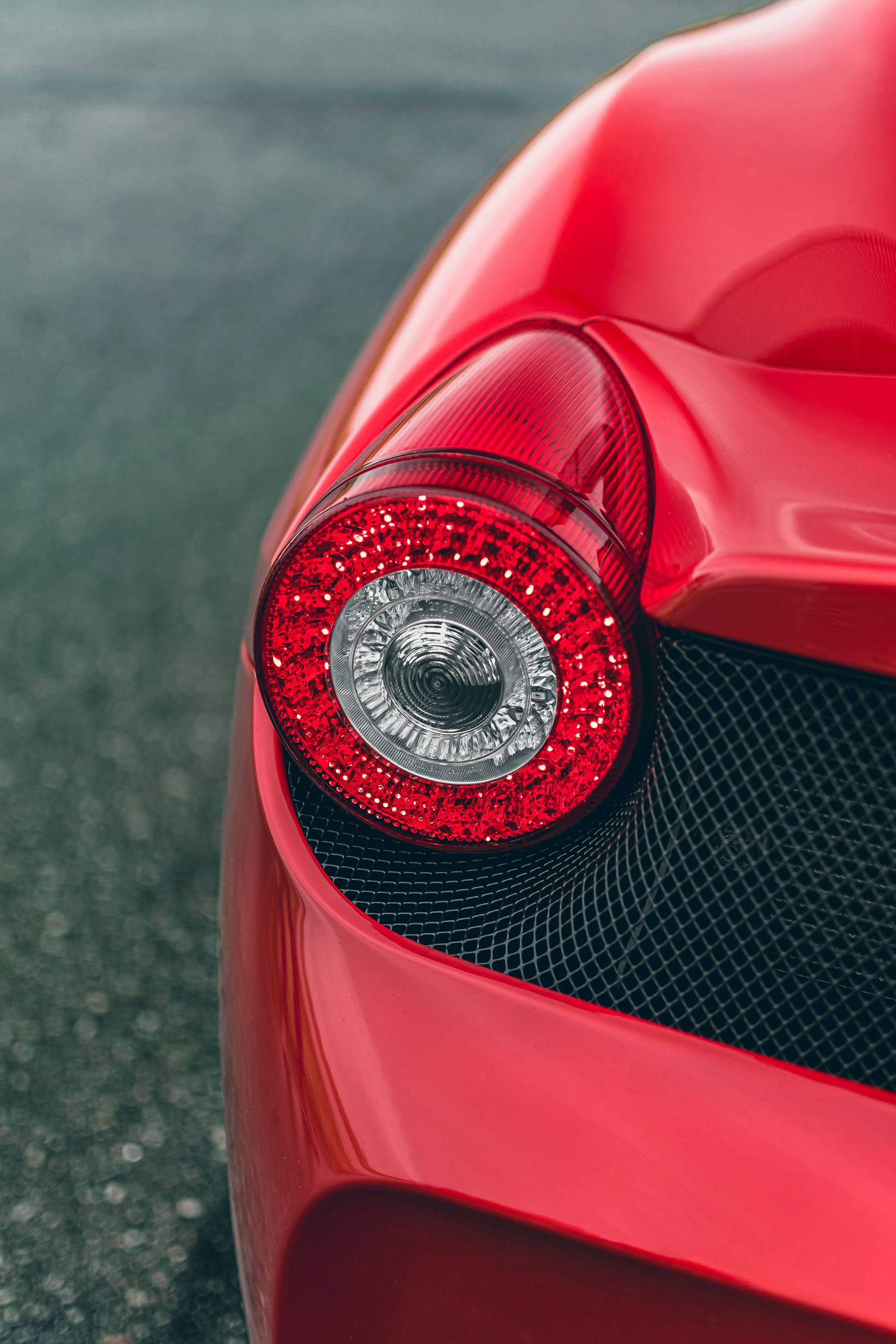 the tail light of a red sports car