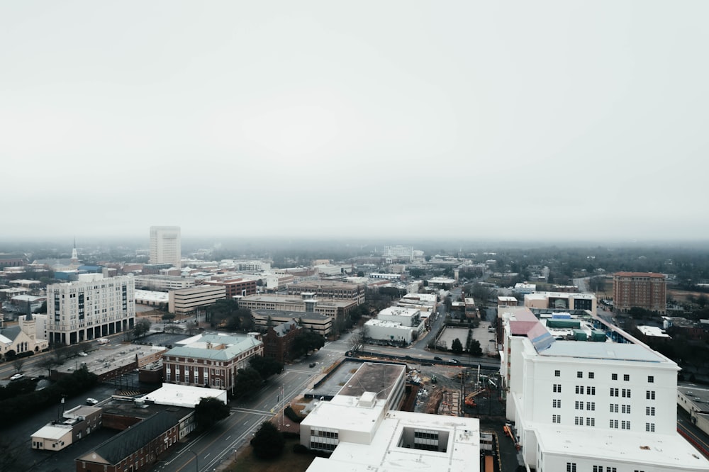 an aerial view of a city in the fog