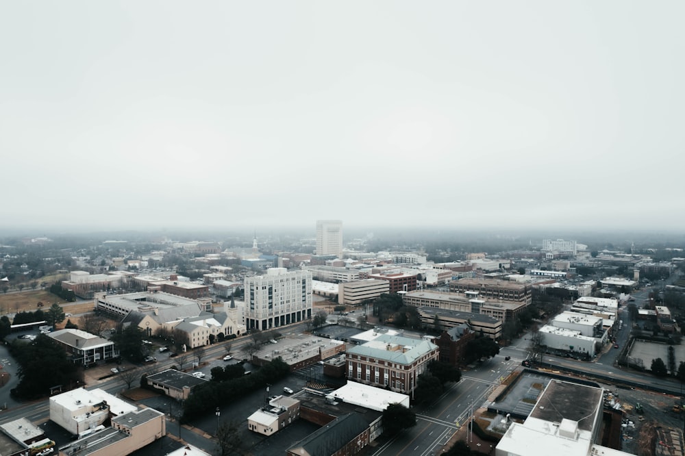 an aerial view of a city in the fog