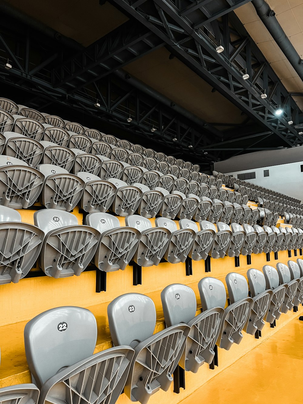 a row of empty chairs in a large auditorium
