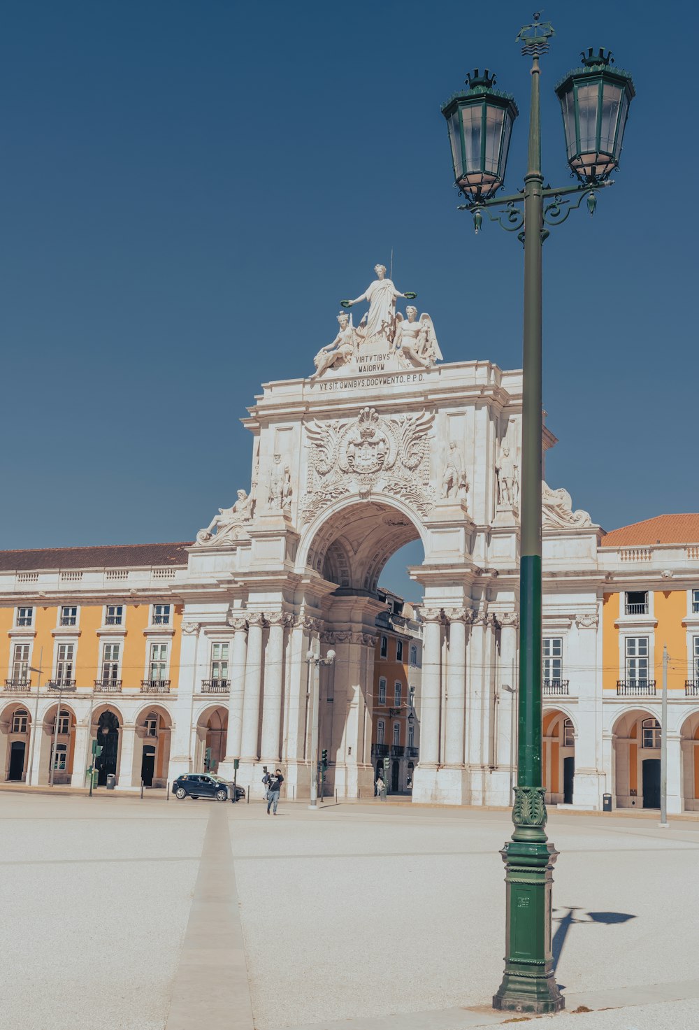 a street light in front of a large building