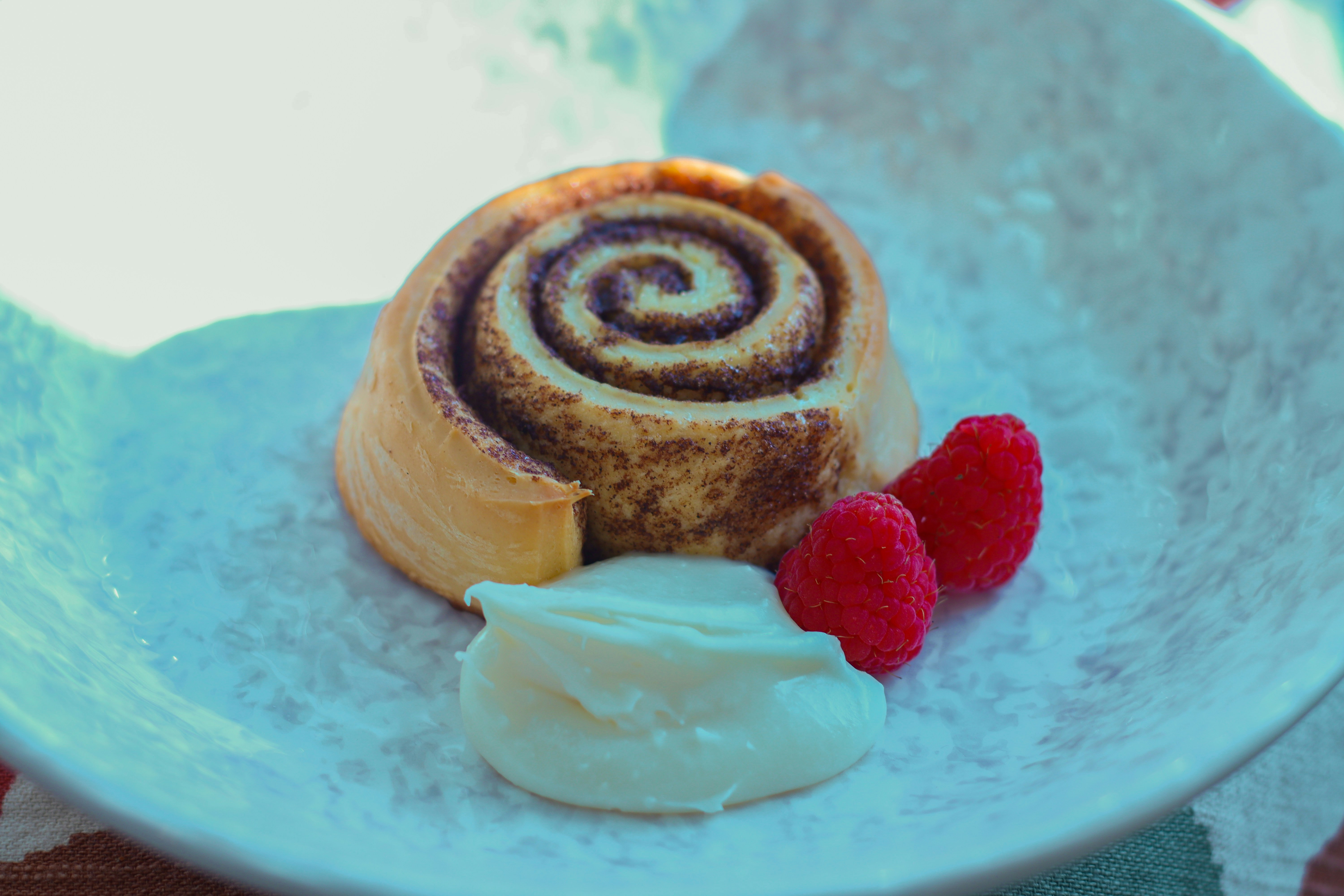 Cinnamon scroll with raspberries