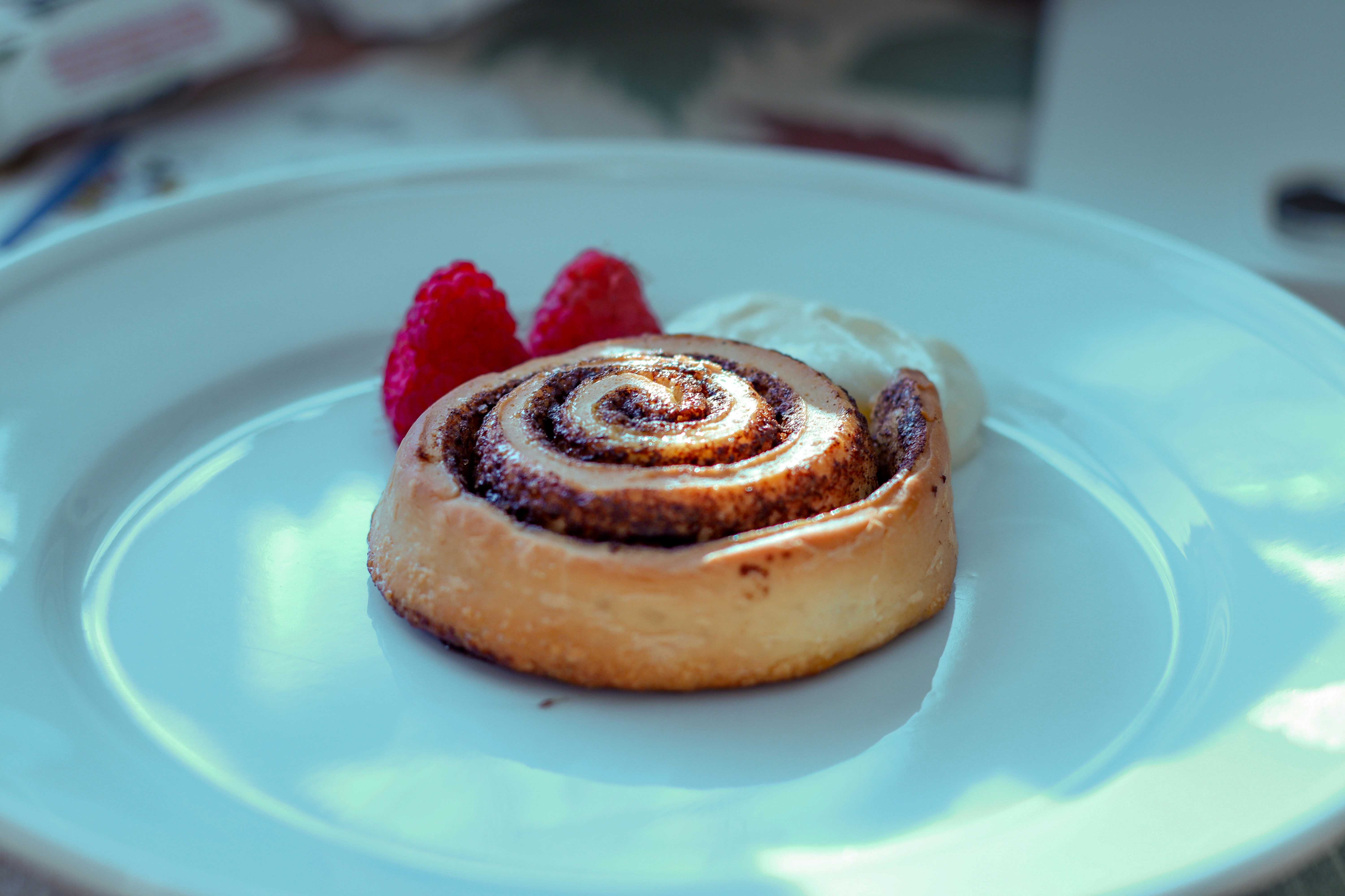 Cinnamon roll with raspberries