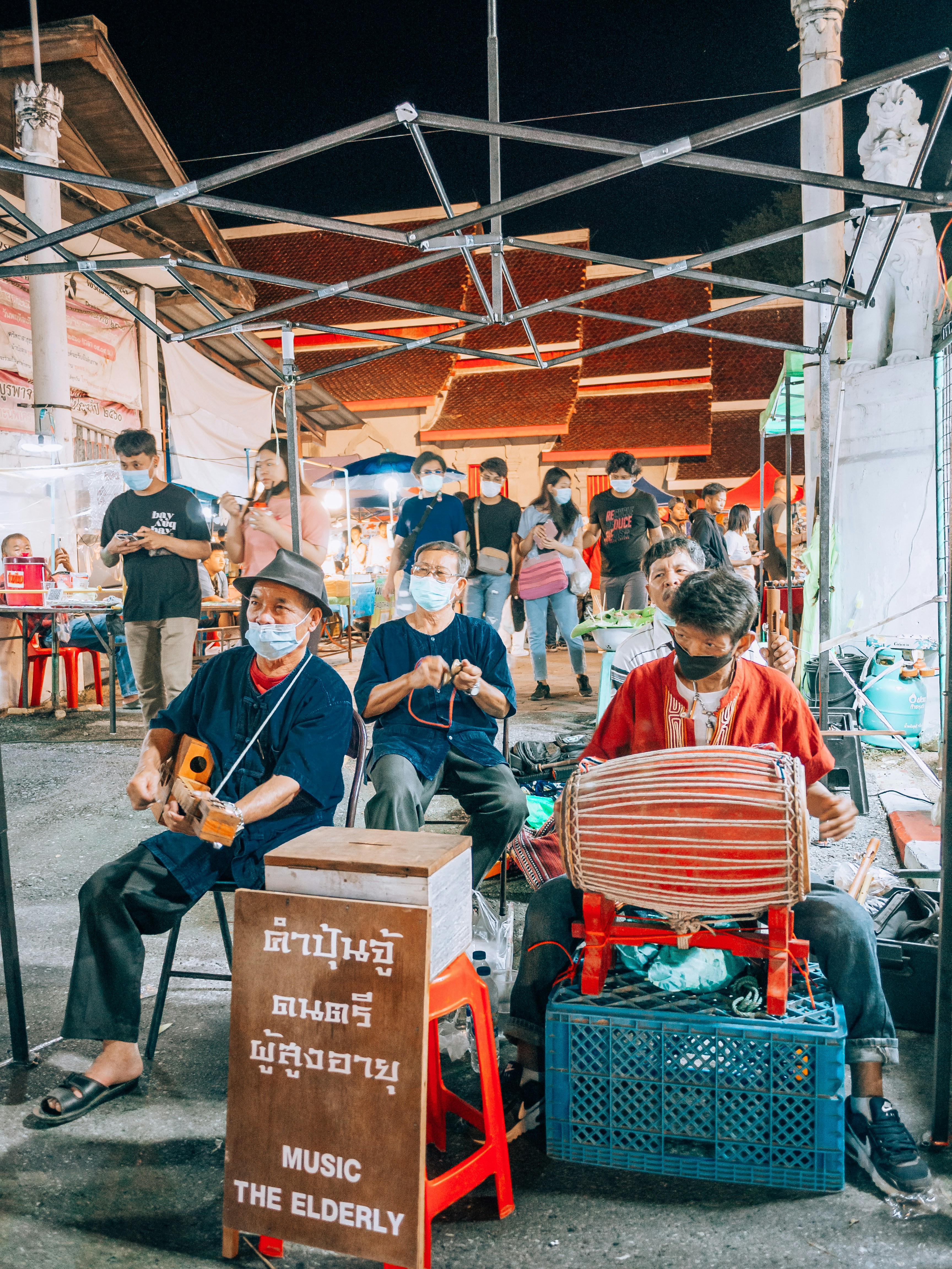 a group of people sitting around each other