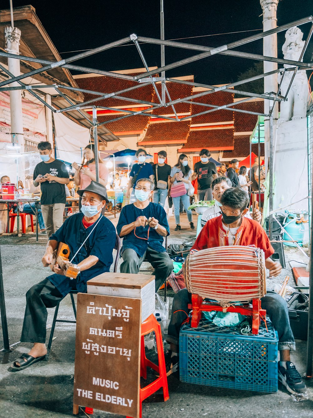 a group of people sitting around each other