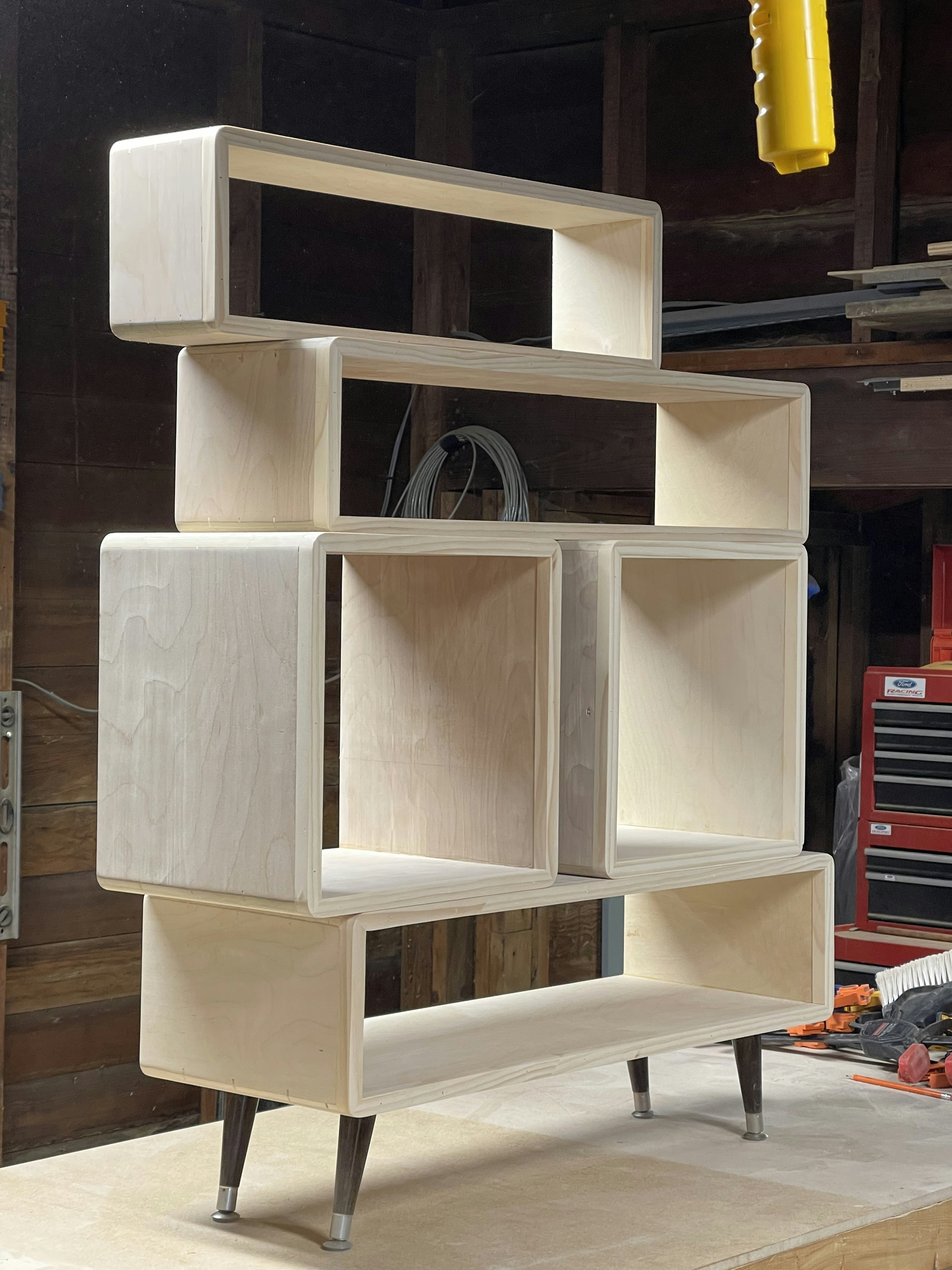 a shelf made out of plywood in a garage