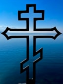 a cross that is sitting in the water