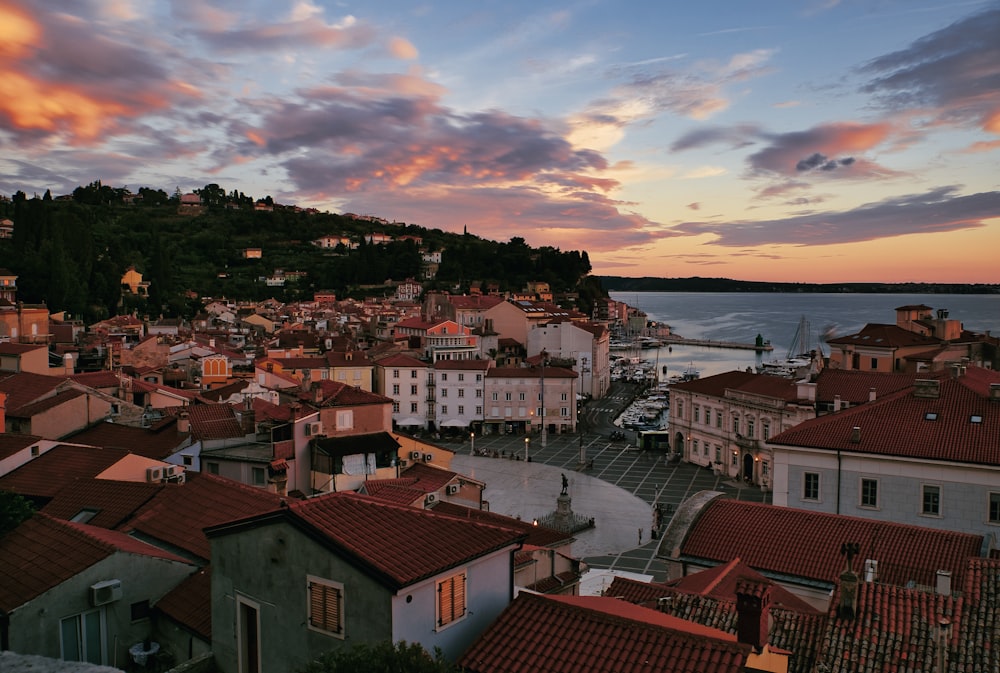 a sunset view of a small town by the water