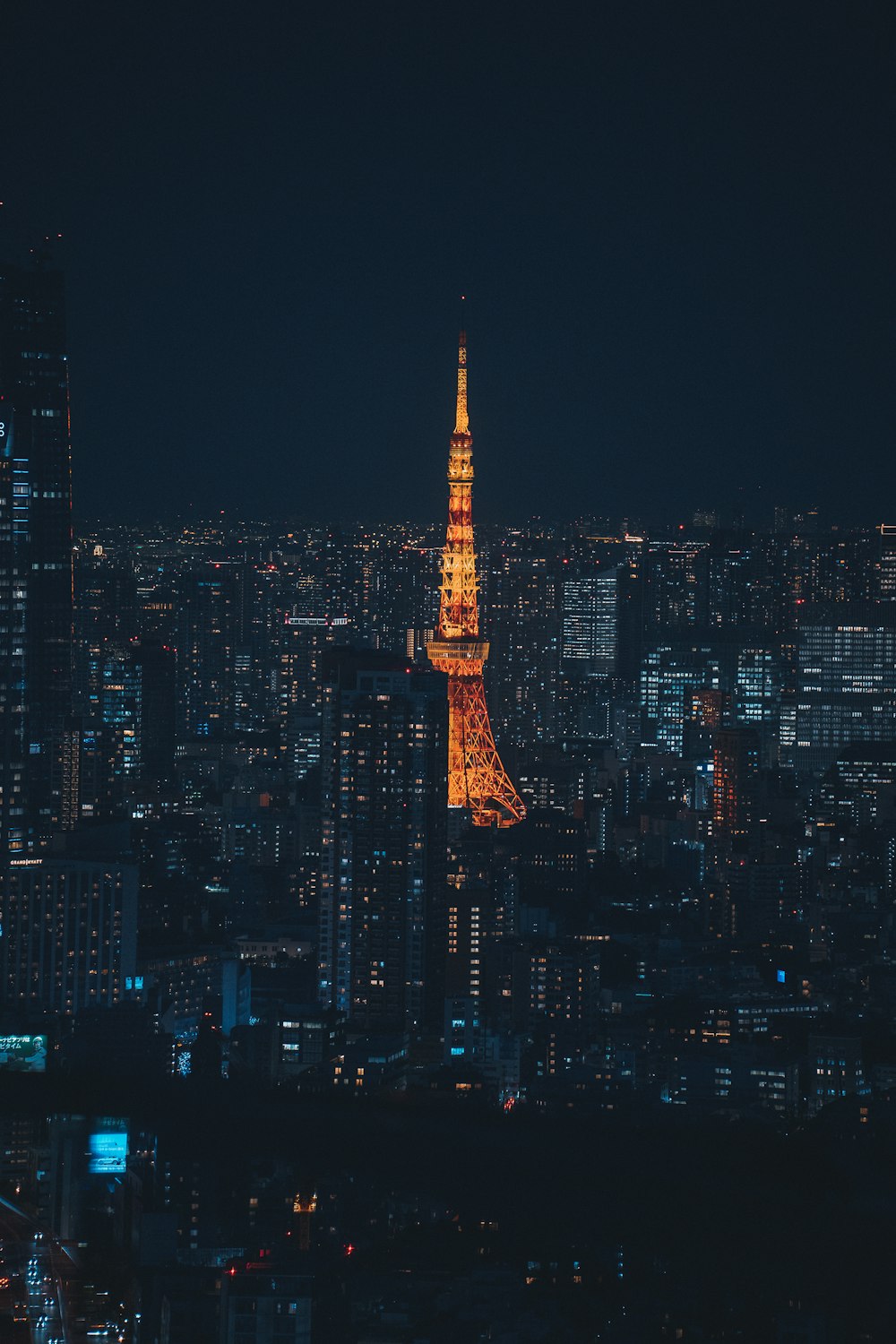 the eiffel tower is lit up at night