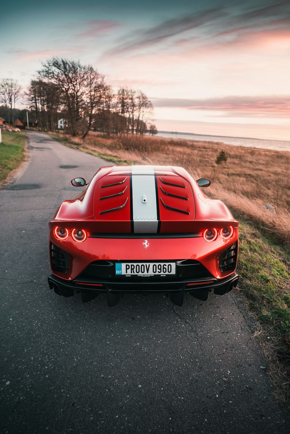 a red sports car parked on the side of a road