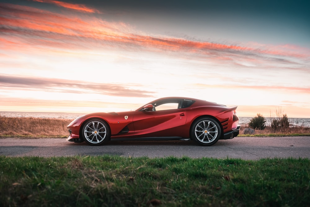 a red sports car parked on the side of the road