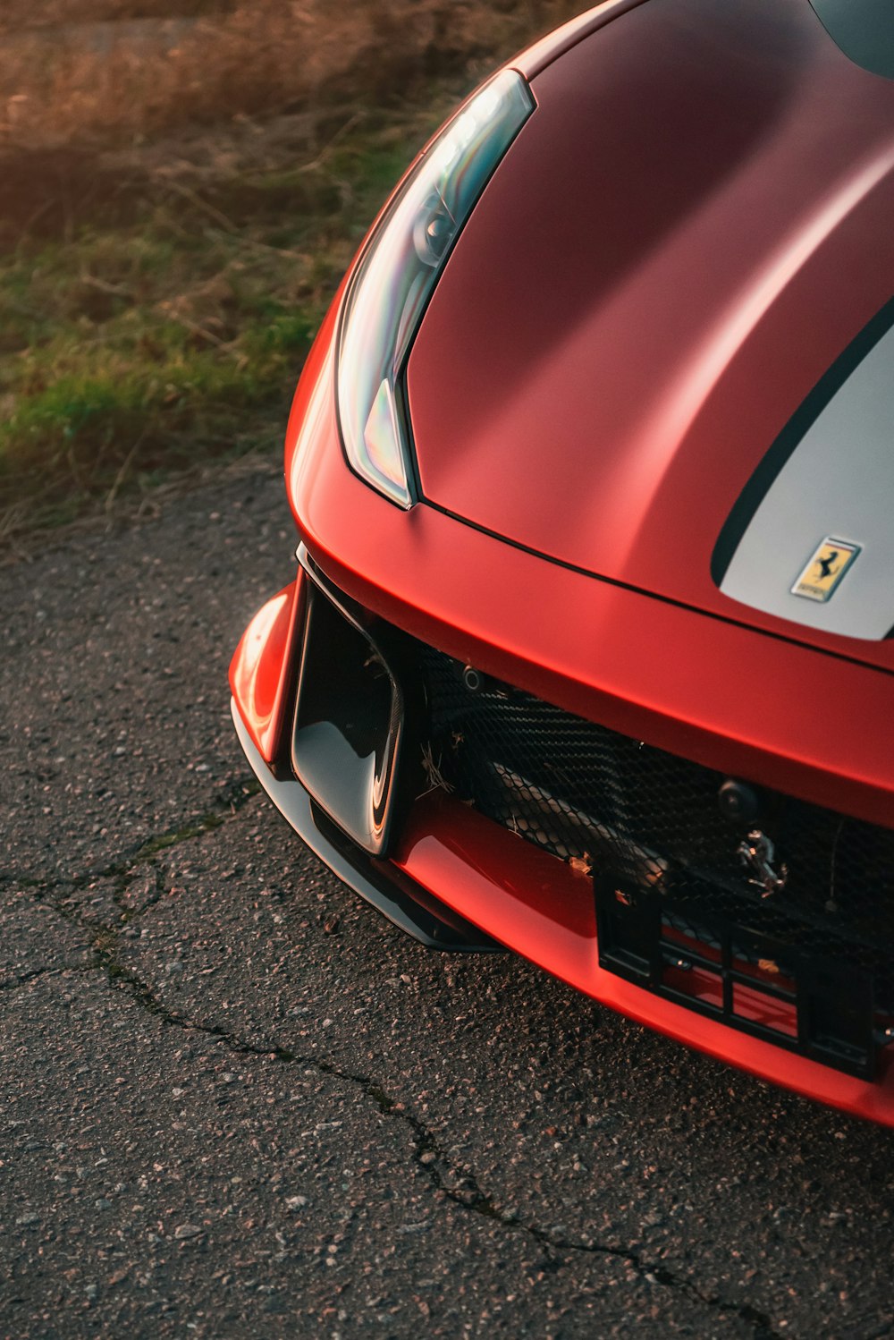 the front end of a red sports car
