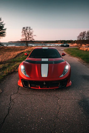 a red sports car parked on the side of a road