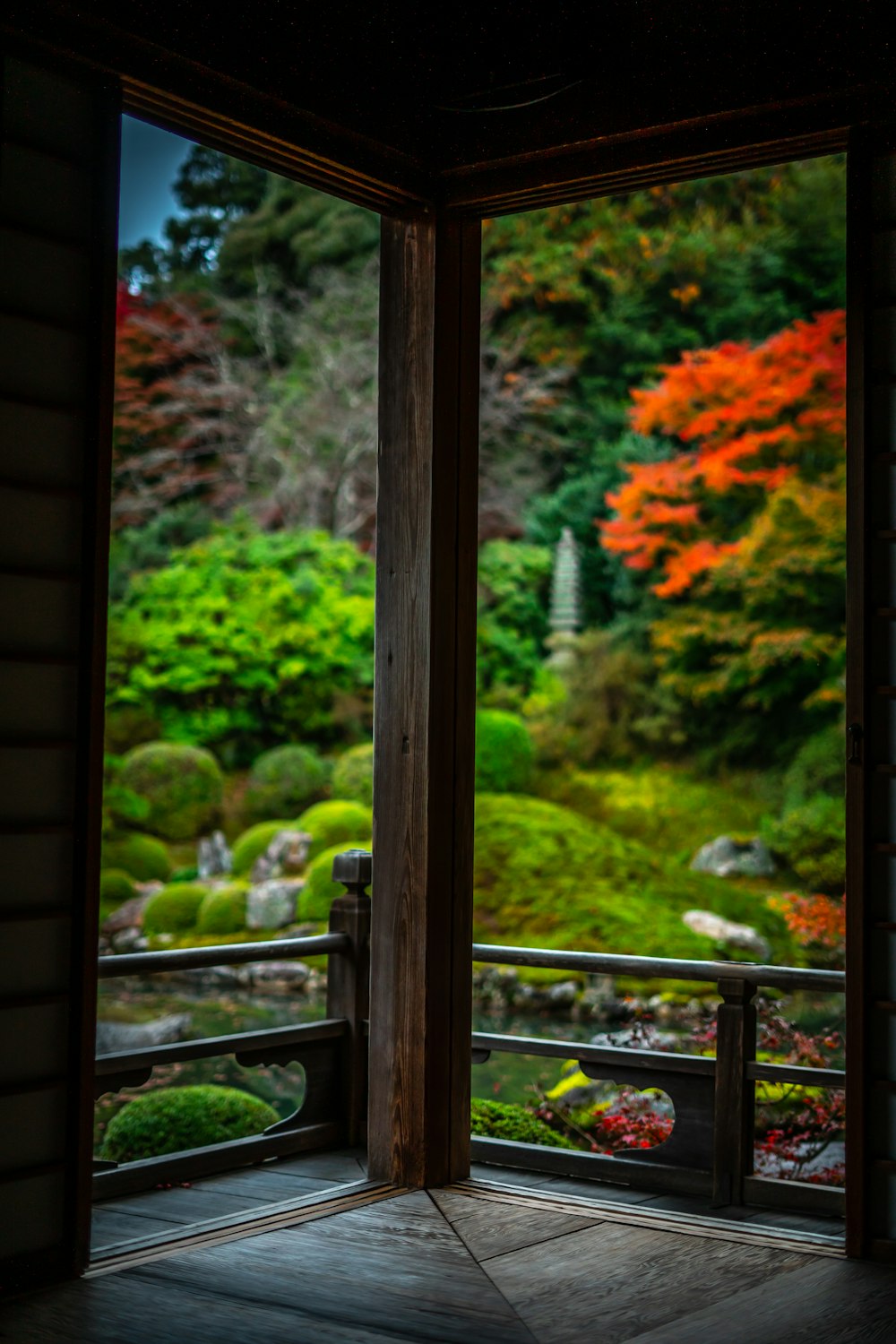 an open window with a view of a garden