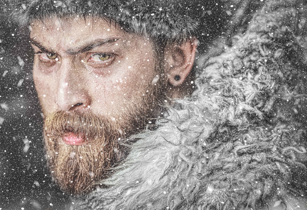 a man with a beard wearing a fur coat