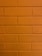 a close up of a brick wall with a clock on it