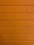 a close up of a brick wall with a clock on it
