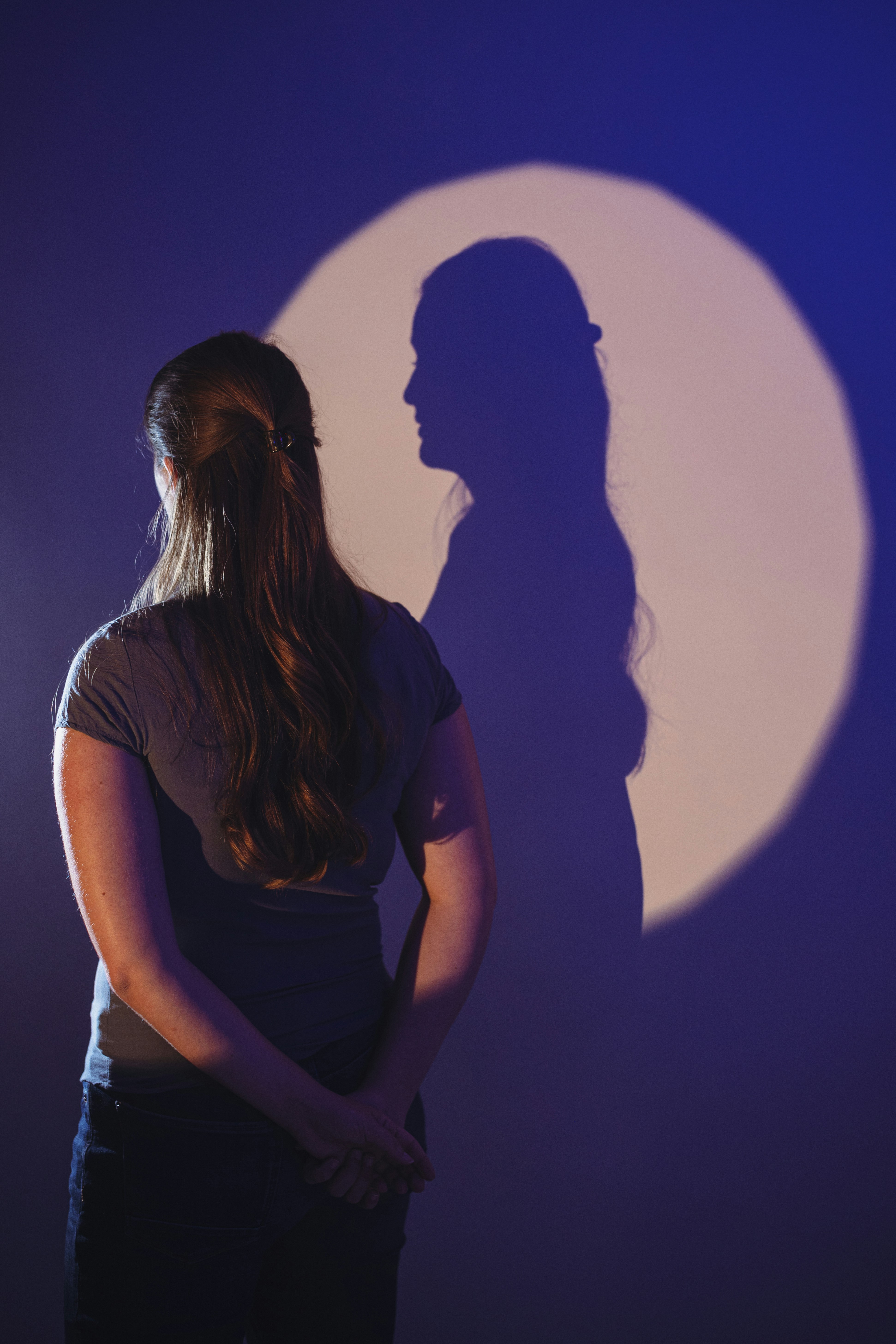 A woman standing in front of a full moon photo – Free Woman Image on ...