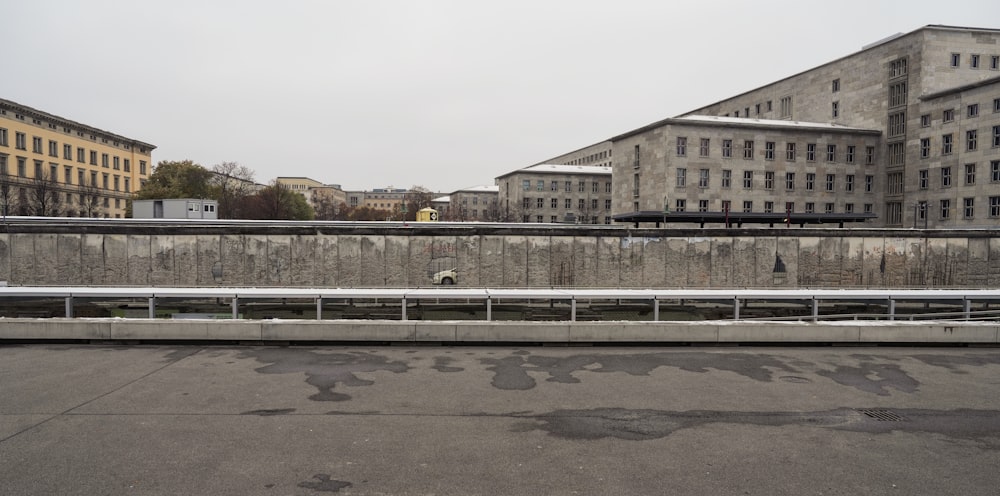 an empty parking lot in front of some buildings