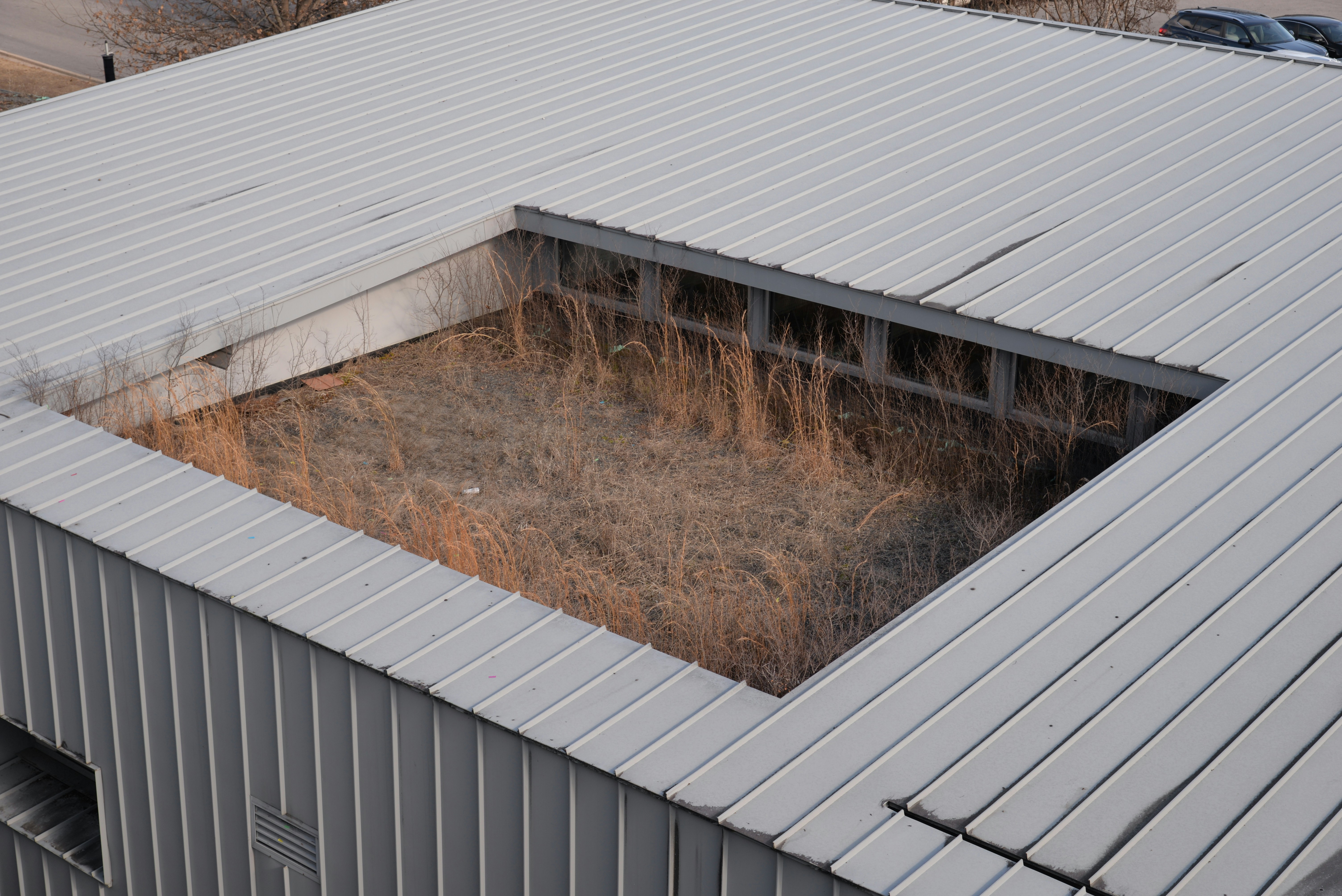 a metal building with a car parked in it
