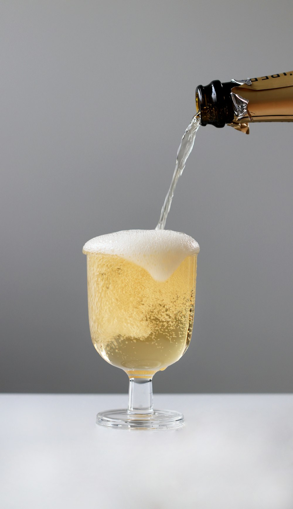 a bottle of champagne being poured into a glass