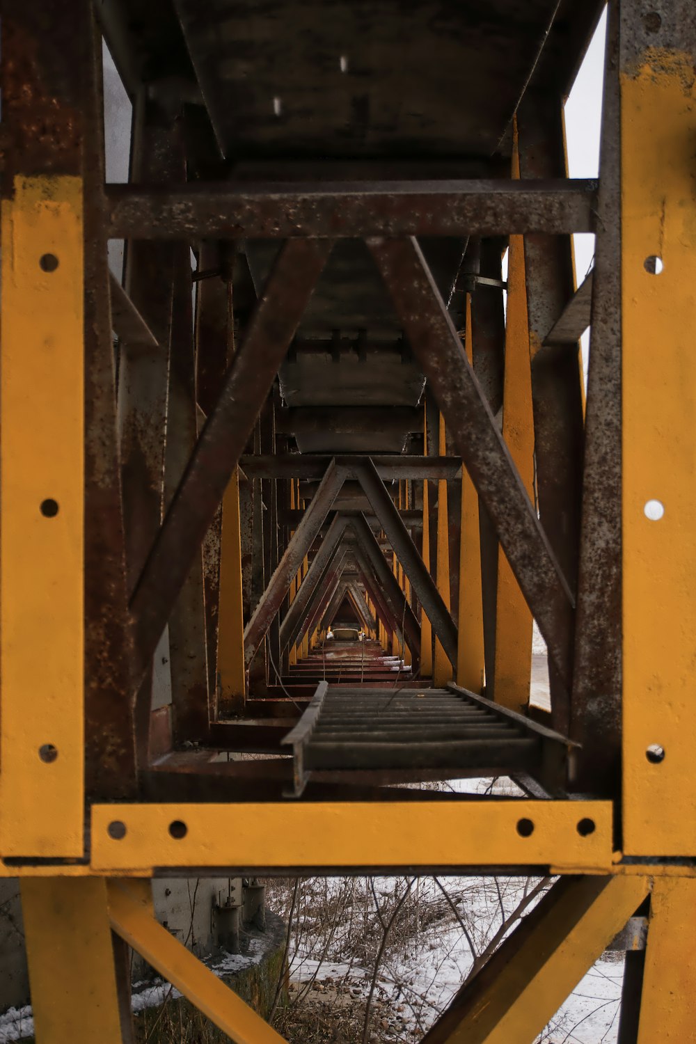 a view of a bridge from the bottom of it