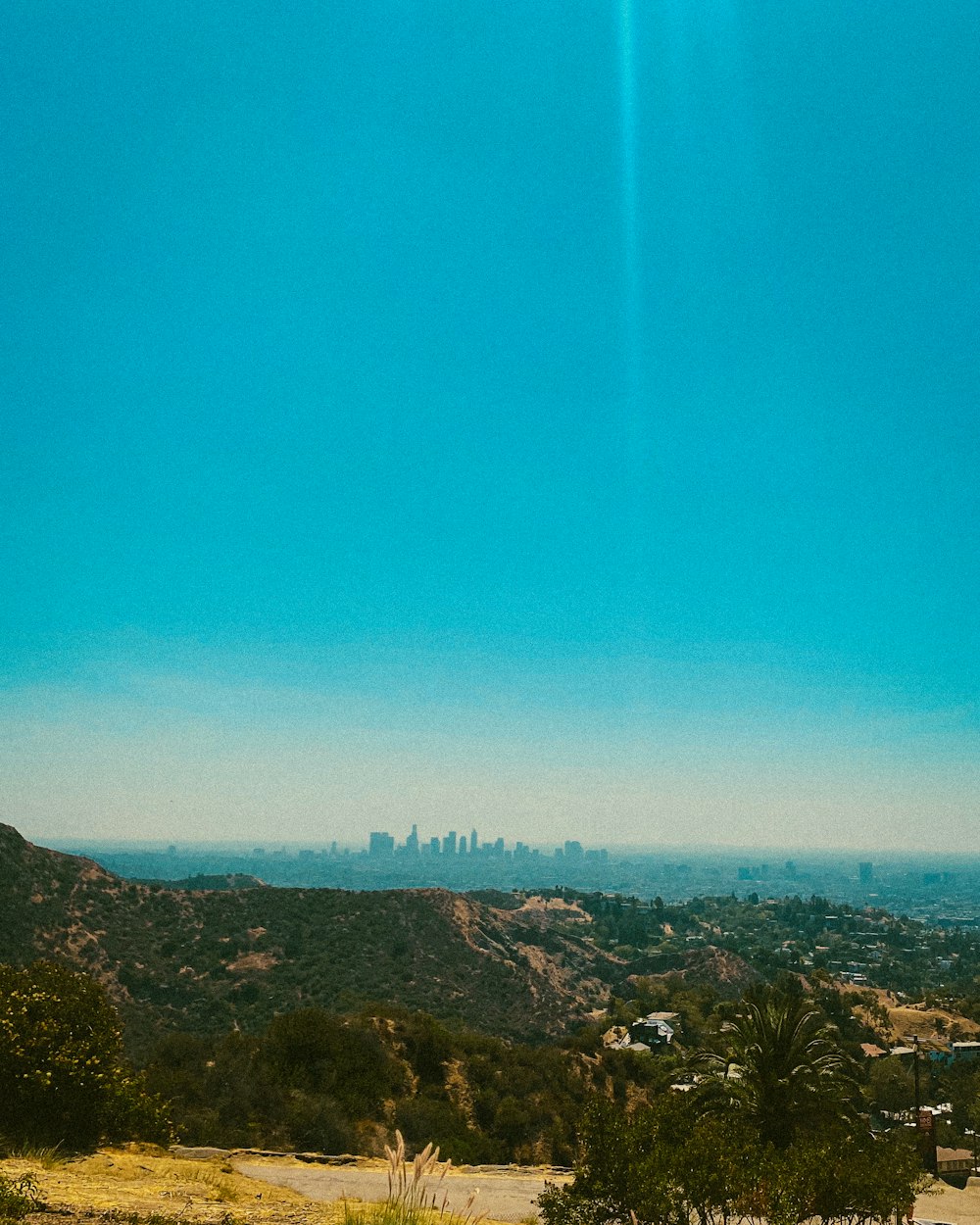 a view of a city from the top of a hill