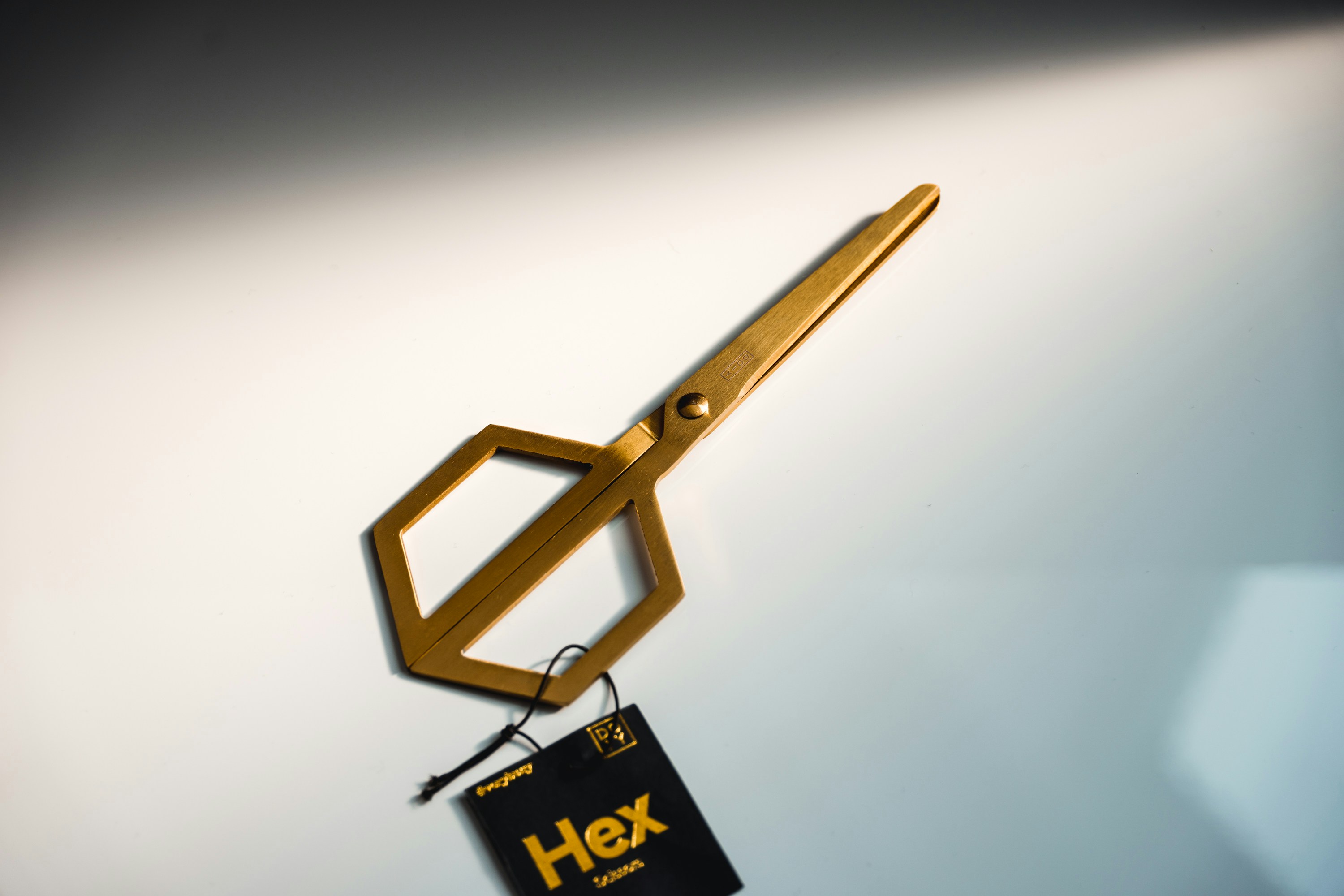 a hex key hanging from a hook on a wall