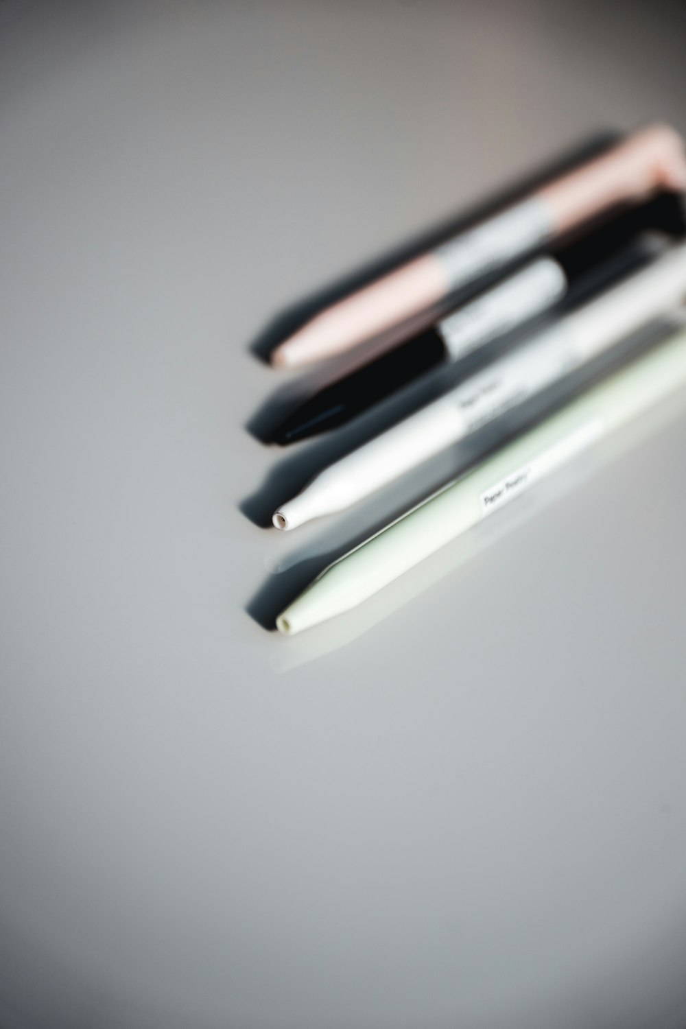 a group of three pens sitting on top of a table
