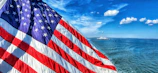 a large american flag on the side of a boat