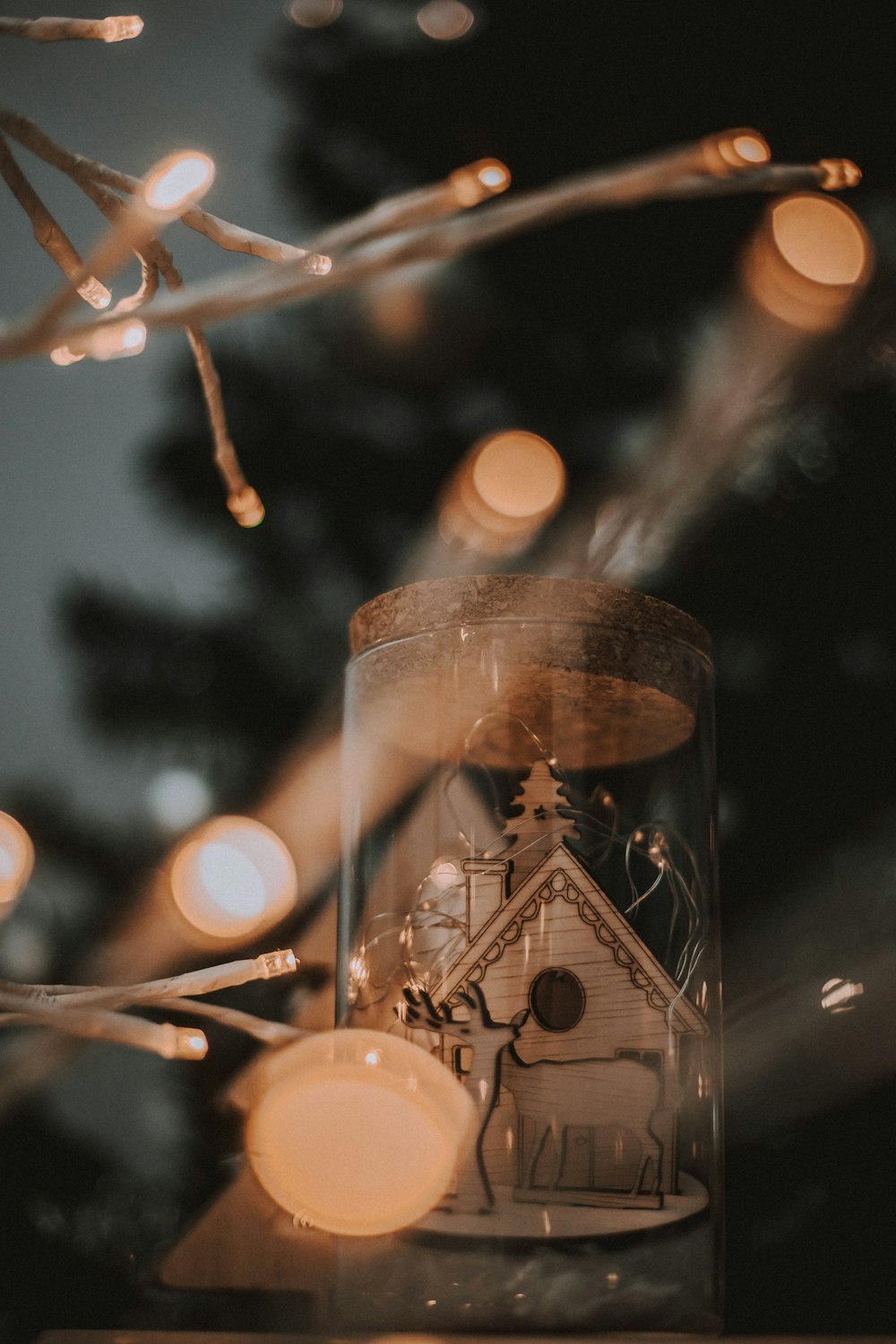 a glass jar with a clock inside of it