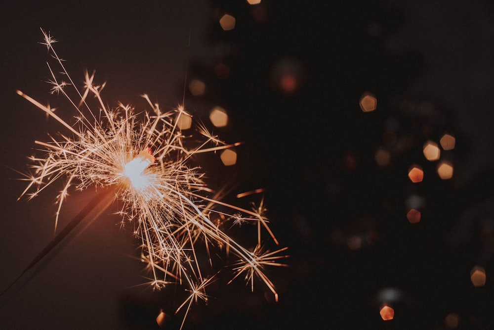 a close up of a sparkler on a black background