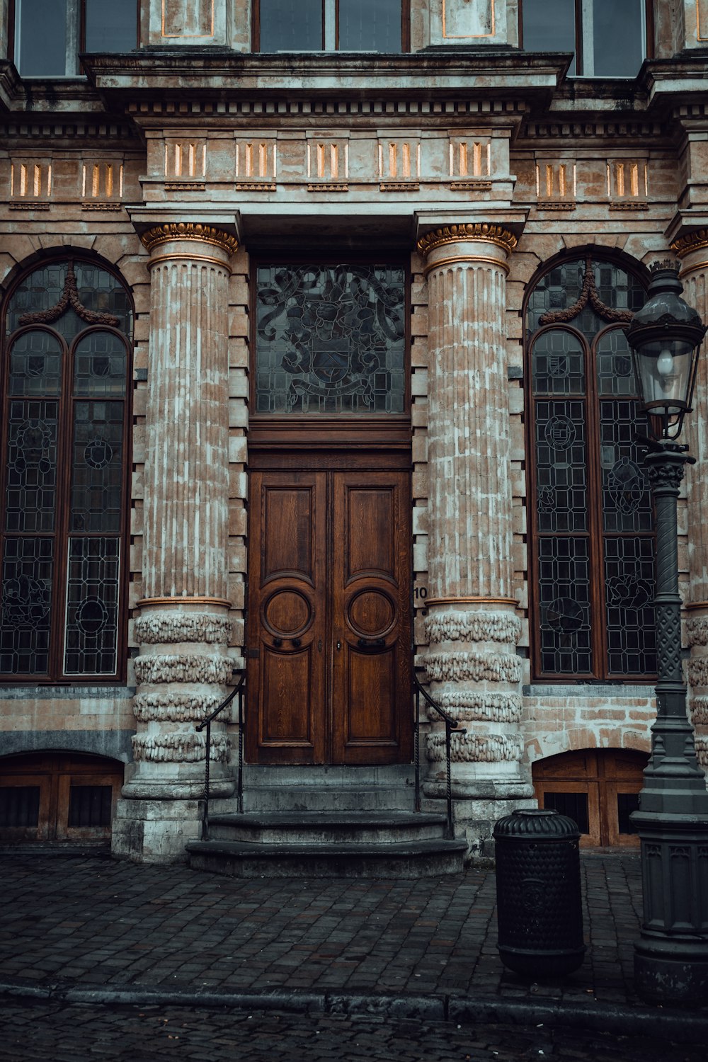 an old building with a wooden door and windows